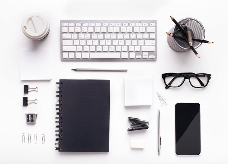 corporate-style-supplies-on-workplace-with-keyboard
